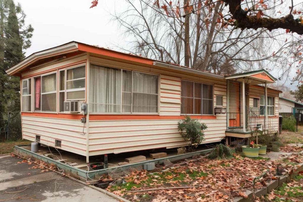 A Mobile House With A Porch And A Driveway