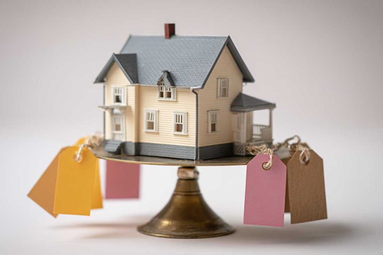 senthi2034 A house model sitting on a scale with price tags - Real Estate News Blog senthi2034 A house model sitting on a scale with price tags -